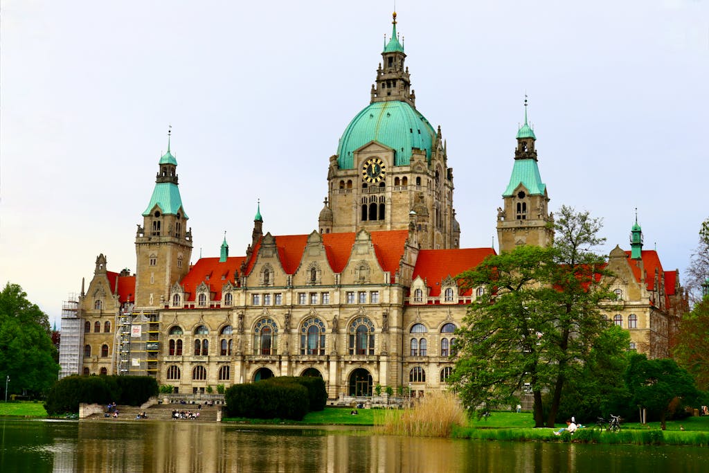 Stunning view of the New Town Hall in Hannover with a reflection in the pond.
